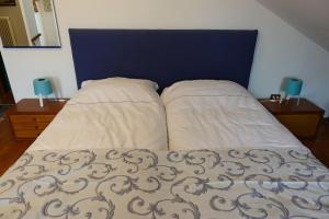 Postel nebo postele na pokoji v ubytování B&B Piccole Dolomiti