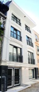 a white building with windows and balconies on it at Basilissis Hotel in Istanbul