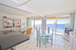 a kitchen and living room with a view of the ocean at PROMENADE HOLIDAY - SEA FRONT PALATIN in Nice