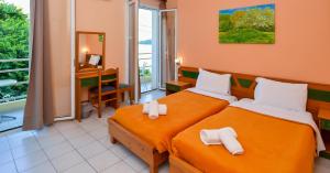 Postel nebo postele na pokoji v ubytování Costa Hotel