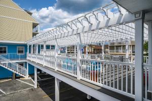 a white railing on the side of a building at Madison Beach Motel in Ocean City +6 photos