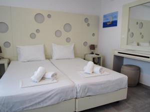 Cama ou camas em um quarto em Chaniotis Studios