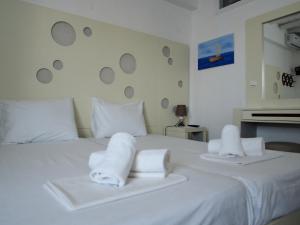 Cama ou camas em um quarto em Chaniotis Studios