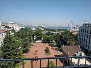 a view of a park from a balcony of a building at Hali Hotel in Istanbul