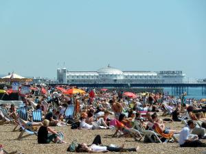 a large crowd of people on a beach at Number 75 in Brighton & Hove