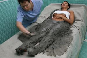 a woman laying in a hospital bed with a man at Hotel Terme Marconi in Montegrotto Terme +35 photos