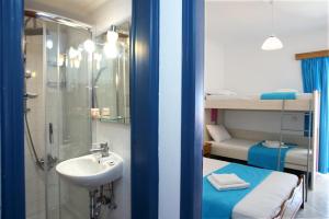 a bathroom with a sink and a shower next to a sink at Kathisma Studios Apartments-Theochari Angeliki GP in Agios Nikitas +35 photos