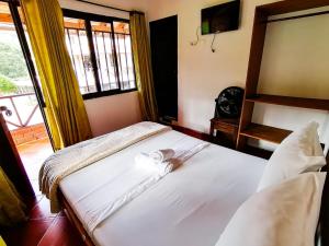 Łóżko lub łóżka w pokoju w obiekcie Casa Campestre Las Nieves