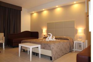 Un pat sau paturi într-o cameră la Hotel Ristorante Mariano