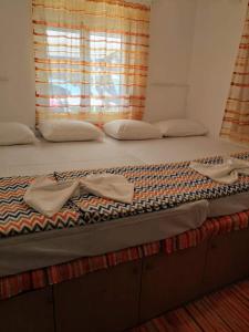 Postel nebo postele na pokoji v ubytování Marina Beach House