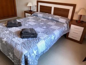 A bed or beds in a room at Casa Pepe