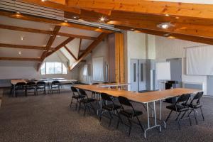 a large room with tables and chairs in it at Hôtel Le Nautic in Arcachon