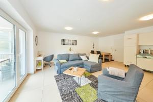 a living room with a couch and a table at Ferienwohnung Bella Vista in Bernkastel-Kues