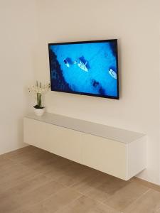 Telewizja i/lub zestaw kina domowego w obiekcie LUNA SON BOU