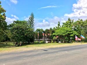 a view of a street with trees and a house at RTMS Guesthouse Semporna in Semporna