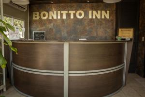 a reception desk with a sign that reads bombino inn at BONITTO INN® Tampico Altamira in Tampico