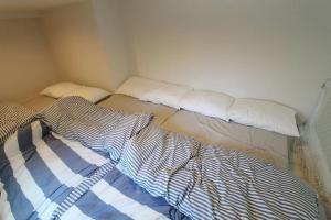 Кровать или кровати в номере Building A101 / Vacation STAY 1274