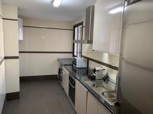 Kuchyň nebo kuchyňský kout v ubytování Apartment Lucena Center Bajo Parking Gratis