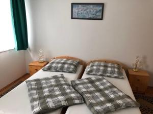Postel nebo postele na pokoji v ubytování Pacsirta Apartman