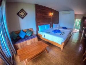 Voodi või voodid majutusasutuse The Cinnamon & SaphanSufan Resort Kohmak toas