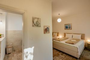 Postel nebo postele na pokoji v ubytování Bobana Apartments