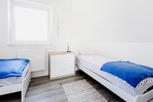 Posteľ alebo postele v izbe v ubytovaní Domki Na Dobrym Kursie