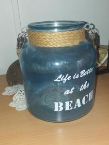 a jar that says life is better at the beach at Apartment Nono Ivo in Vis
