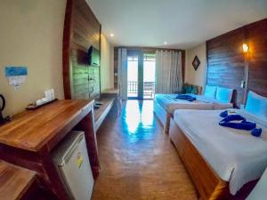 Postel nebo postele na pokoji v ubytování The Cinnamon & SaphanSufan Resort Kohmak + 10 fotografií