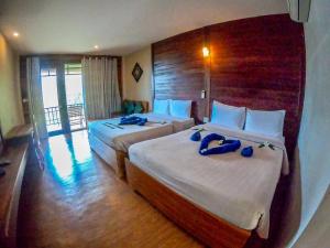 Voodi või voodid majutusasutuse The Cinnamon & SaphanSufan Resort Kohmak toas