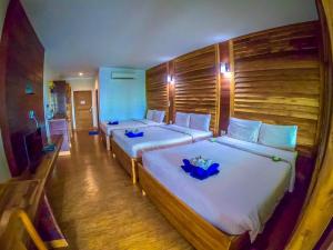 Voodi või voodid majutusasutuse The Cinnamon & SaphanSufan Resort Kohmak toas