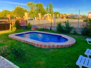 a small pool in the middle of a yard at LOS ROSALES in Alcaracejos