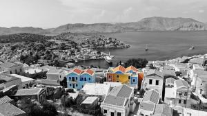 a black and white photo of a city with houses at Hotel Fiona Symi in Symi