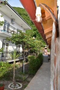 a walkway leading to a building with a balcony at Villa Marija in Ohrid