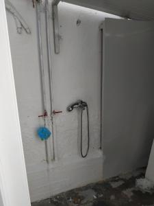 a shower in the corner of a bathroom at Beachfront Eva's House in Karianí +43 photos