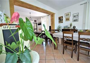 a living room with a table and a dining room at Agriturismo Due Ganèe in Agrigento