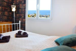 a bedroom with a bed with a view of the ocean at Bella Vista Sun Club in Puerto de Mogán