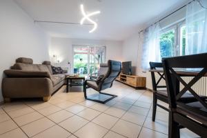 Posezení v ubytování Ferienhaus im Grünen