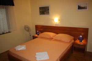 Postel nebo postele na pokoji v ubytování Apartments Villa Olga
