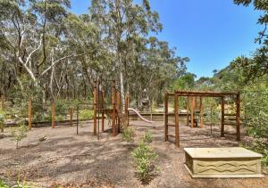 an empty playground in a park with trees at Sinofield Edu-Retreat in Leura +52 photos