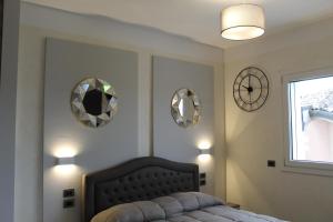 A bed or beds in a room at Villa Martina Luxury Rooms