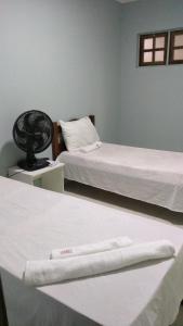 Een bed of bedden in een kamer bij Pousada Bela Vista