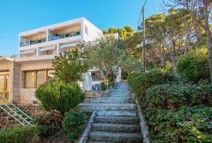 a stairway leading up to a house at Marios in Brela