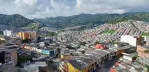 a view of a city with a lot of buildings at Hostal Triangulo del Café in Manizales