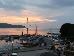 a group of cars parked in a marina with boats at Arcobaleno isolano in Izola