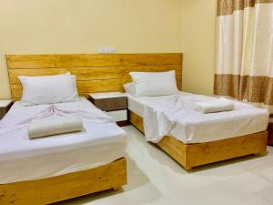 Postel nebo postele na pokoji v ubytování Endhaa, Divers Home