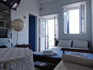 Posteľ alebo postele v izbe v ubytovaní El Greco Studios