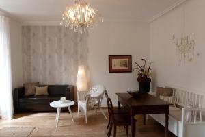 a living room with a couch and a table at Melcher`s in Bernkastel-Kues