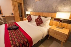 Postel nebo postele na pokoji v ubytování Hotel Adya Express Chenang