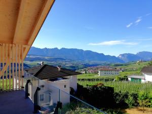 a view from the balcony of a house with mountains in the background at Orizzonti d'Anaunia in Tassullo