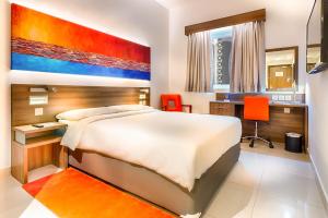 a bedroom with a large bed and a desk at Citymax Hotel Al Barsha at the Mall in Dubai +37 photos